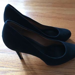 Black suede pumps worn once.